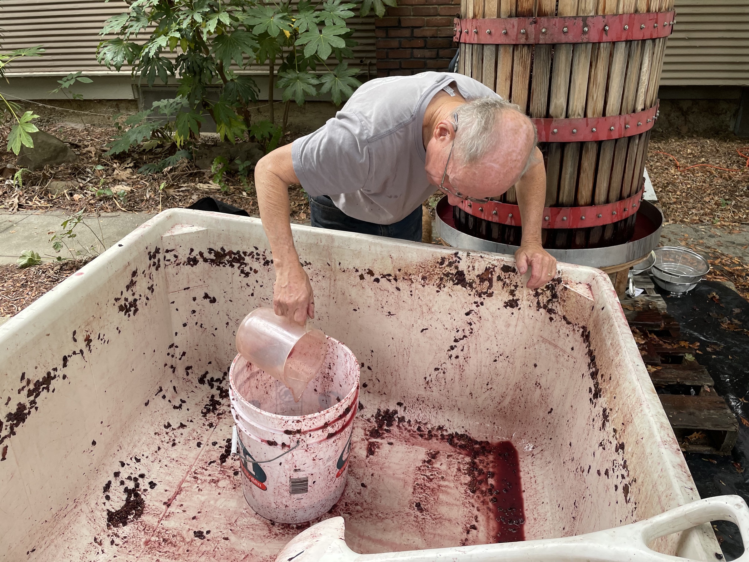 Jim Lapsley pouring from a press